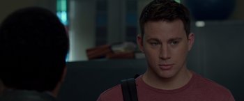 Movie still from “21 Jump Street” (2012), directed by Phil Lord – A person with a backpack; Close Up shot, Over the shoulder angle