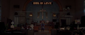 Movie still from “21 Jump Street” (2012), directed by Phil Lord – A man standing in front of a cross in a church; Extreme Wide shot, Low angle