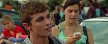 Movie still from “21 Jump Street” (2012), directed by Phil Lord – A man and a woman are looking at a cell phone; Close Up shot, Over the shoulder angle