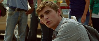 Movie still from “21 Jump Street” (2012), directed by Phil Lord – A young man is looking into the distance; Close Up shot, Over the shoulder angle