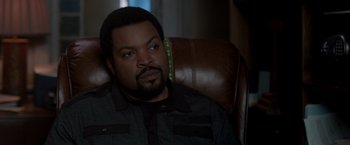 Movie still from “21 Jump Street” (2012), directed by Phil Lord – A person sitting in a chair looking at the camera; Close Up shot, Over the shoulder angle