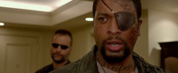 Movie still from “21 Jump Street” (2012), directed by Phil Lord – A person with a tattoo on his face; Close Up shot, Over the shoulder angle
