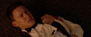 Movie still from “21 Jump Street” (2012), directed by Phil Lord – A man in a white shirt and a black tie; Close Up shot, Overhead angle