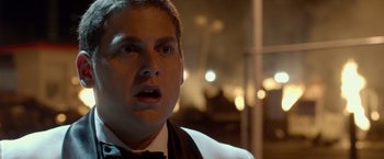 Movie still from “21 Jump Street” (2012), directed by Phil Lord – A person wearing a suit and bow tie; Close Up shot, Over the shoulder angle