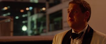 Movie still from “21 Jump Street” (2012), directed by Phil Lord – A person wearing a suit and a bow tie; Close Up shot, Over the shoulder angle