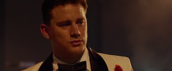 Movie still from “21 Jump Street” (2012), directed by Phil Lord – A person wearing a suit and bow tie; Close Up shot, Over the shoulder angle