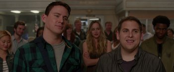 Movie still from “21 Jump Street” (2012), directed by Phil Lord – A group of people standing in a room; Close Up shot, Over the shoulder angle