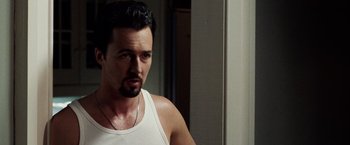 Movie still from “25th Hour” (2002), directed by Spike Lee – A person wearing a white shirt; Close Up shot, Over the shoulder angle