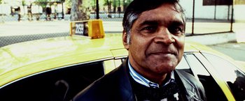 Movie still from “25th Hour” (2002), directed by Spike Lee – A person wearing a suit and bow tie; Close Up shot, Low angle