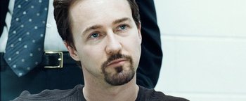 Movie still from “25th Hour” (2002), directed by Spike Lee – A person with a beard; Close Up shot, Over the shoulder angle