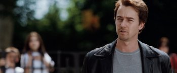 Movie still from “25th Hour” (2002), directed by Spike Lee – A person wearing a leather jacket; Close Up shot, Over the shoulder angle