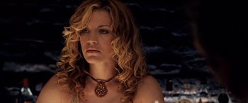 Movie still from “25th Hour” (2002), directed by Spike Lee – A woman with long blonde curly hair wearing a necklace; Close Up shot, Low angle