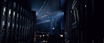 Movie still from “25th Hour” (2002), directed by Spike Lee – A view of a bridge in the night time; Extreme Wide shot, Low angle