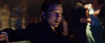 Movie still from “25th Hour” (2002), directed by Spike Lee – A person wearing a black jacket; Close Up shot, Low angle