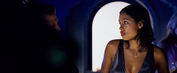 Movie still from “25th Hour” (2002), directed by Spike Lee – A woman in a black dress talking to a man in a blue shirt; Close Up shot, Over the shoulder angle