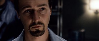 Movie still from “25th Hour” (2002), directed by Spike Lee – A person with a beard; Close Up shot, Over the shoulder angle
