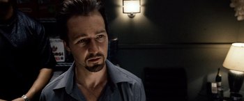 Movie still from “25th Hour” (2002), directed by Spike Lee – A person wearing a shirt; Close Up shot, Over the shoulder angle