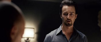 Movie still from “25th Hour” (2002), directed by Spike Lee – A person wearing a shirt; Close Up shot, Over the shoulder angle