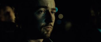 Movie still from “25th Hour” (2002), directed by Spike Lee – A man's face in the dark; Close Up shot, Low angle