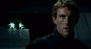 Movie still from “28 Days Later” (2002), directed by Danny Boyle – A person wearing a uniform; Close Up shot, Low angle