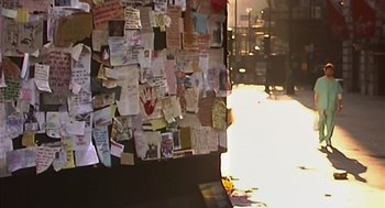 Movie still from “28 Days Later” (2002), directed by Danny Boyle – A wall covered with lots and lots of papers; Extreme Close Up shot, High angle