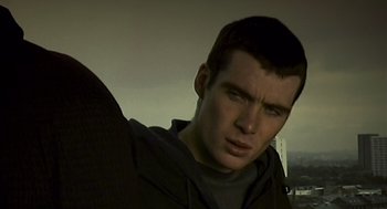 Movie still from “28 Days Later” (2002), directed by Danny Boyle – A person wearing a hooded sweatshirt; Close Up shot, Low angle