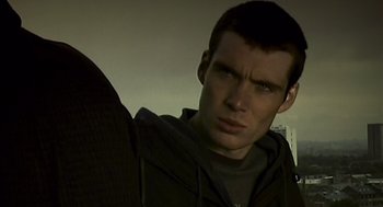 Movie still from “28 Days Later” (2002), directed by Danny Boyle – A person wearing a hooded sweatshirt; Close Up shot, Low angle