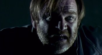 Movie still from “28 Days Later” (2002), directed by Danny Boyle – A person with a beard; Close Up shot, Low angle