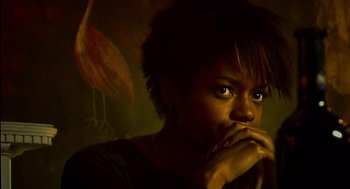 Movie still from “28 Days Later” (2002), directed by Danny Boyle – A person with their hand on her face; Close Up shot, Low angle