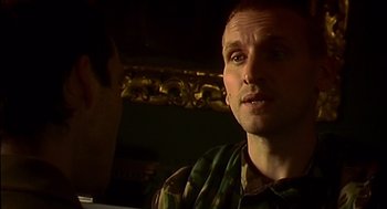 Movie still from “28 Days Later” (2002), directed by Danny Boyle – A person in a military uniform; Close Up shot, Over the shoulder angle