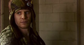 Movie still from “28 Days Later” (2002), directed by Danny Boyle – A person wearing a pirate hat; Close Up shot, Over the shoulder angle