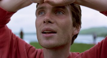 Movie still from “28 Days Later” (2002), directed by Danny Boyle – A person with his hands in the air; Close Up shot, Low angle