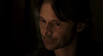 Movie still from “28 Weeks Later” (2007), directed by Juan Carlos Fresnadillo – A person looking at the camera; Close Up shot, Over the shoulder angle
