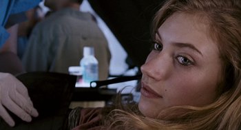 Movie still from “28 Weeks Later” (2007), directed by Juan Carlos Fresnadillo – A person with a pen in her mouth; Close Up shot, High angle