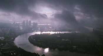 Movie still from “28 Weeks Later” (2007), directed by Juan Carlos Fresnadillo – A view of a city from a hill with a cloudy sky above it; Extreme Wide shot, High angle