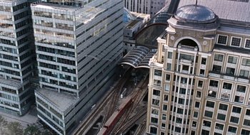 Movie still from “28 Weeks Later” (2007), directed by Juan Carlos Fresnadillo – An aerial view of a train station in a city; Extreme Wide shot, High angle