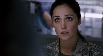 Movie still from “28 Weeks Later” (2007), directed by Juan Carlos Fresnadillo – A woman in a military uniform looking to her left; Close Up shot, Over the shoulder angle