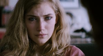 Movie still from “28 Weeks Later” (2007), directed by Juan Carlos Fresnadillo – A person with long blonde hair; Close Up shot, Over the shoulder angle