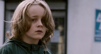 Movie still from “28 Weeks Later” (2007), directed by Juan Carlos Fresnadillo – A person with long blonde hair; Close Up shot, Low angle