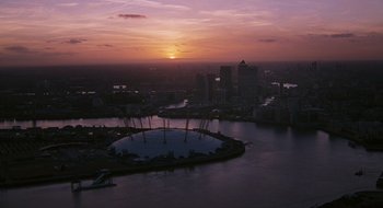 Movie still from “28 Weeks Later” (2007), directed by Juan Carlos Fresnadillo – The sun sets over the city of london and the o 2 arena; Extreme Wide shot, High angle