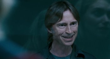 Movie still from “28 Weeks Later” (2007), directed by Juan Carlos Fresnadillo – A person with long black hair; Close Up shot, Over the shoulder angle