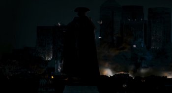 Movie still from “28 Weeks Later” (2007), directed by Juan Carlos Fresnadillo – A statue in the middle of the night with smoke coming out of it; Extreme Wide shot, Low angle