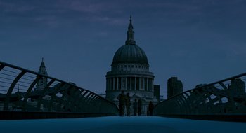 Movie still from “28 Weeks Later” (2007), directed by Juan Carlos Fresnadillo – A group of people walking across a bridge at night; Extreme Wide shot, Low angle