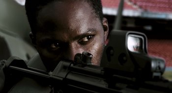 Movie still from “28 Weeks Later” (2007), directed by Juan Carlos Fresnadillo – A person holding a gun; Extreme Close Up shot, Low angle