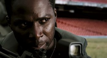 Movie still from “28 Weeks Later” (2007), directed by Juan Carlos Fresnadillo – A man's face while looking at a camera; Close Up shot, Low angle