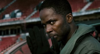 Movie still from “28 Weeks Later” (2007), directed by Juan Carlos Fresnadillo – A person wearing a glove; Close Up shot, Low angle