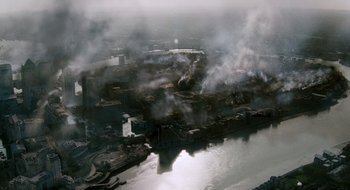 Movie still from “28 Weeks Later” (2007), directed by Juan Carlos Fresnadillo – An aerial view of an industrial area near a body of water; Extreme Wide shot, High angle