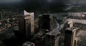 Movie still from “28 Weeks Later” (2007), directed by Juan Carlos Fresnadillo – An aerial view of a city with smoke coming out of the buildings; Extreme Wide shot, High angle