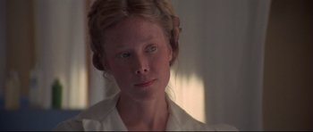 Movie still from “3 Women” (1977), directed by Robert Altman – A young woman with blue eyes looking into the distance; Close Up shot, Over the shoulder angle