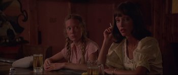 Movie still from “3 Women” (1977), directed by Robert Altman – Two women sitting at a table in front of drinks; Close Up shot, Low angle